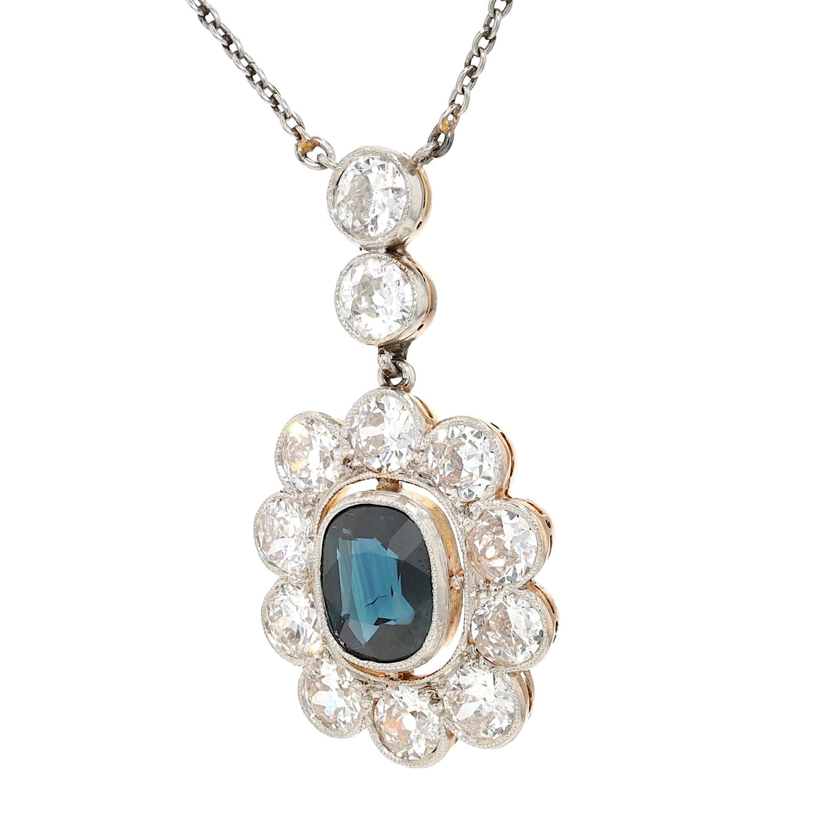 Art Déco Kette aus Platin und 585er Gelbgold mit einem blauen Saphir ca. 1,4 ct und Diamanten mit ca. 2,0 ct, hängend links gedreht