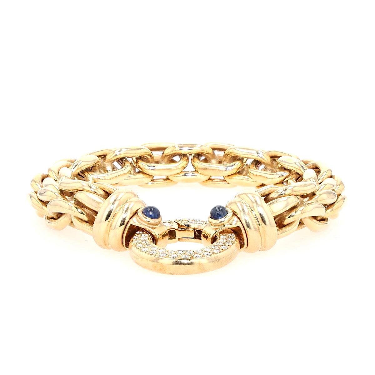 Peter Fischer - großes Gliederarmband von in 585er Gelbgold mit Brillanten und blauen Saphir-Cabochons, liegend frontal Schloss flach liegend