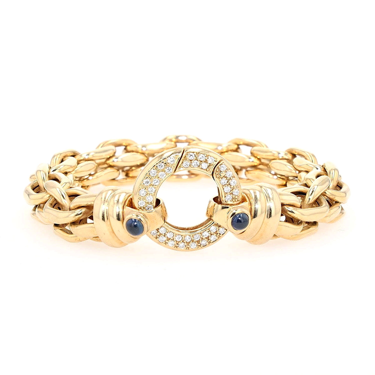 Peter Fischer - großes Gliederarmband von in 585er Gelbgold mit Brillanten und blauen Saphir-Cabochons, liegend frontal Schloss aufrecht