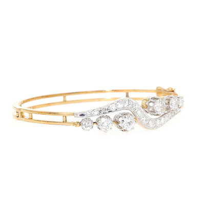 Vintage Armreif in 585er Gold mit insgesamt ca. 2,9 ct Brillanten und Diamanten, liegend rechts gedreht