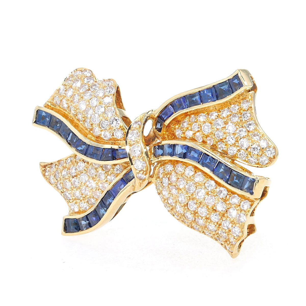 Brosche in 750er Gelbgold mit insgesamt ca. 1 ct Brillanten und blauen Saphiren, stehend inks gedreht
