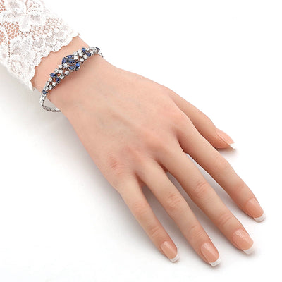 Exklusives Vintage Armband um 1970 in 750er Weißgold mit blauen Saphiren und ca. 2,0 ct Brillanten