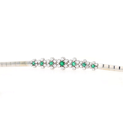 Armband in 750er Weißgold mit Diamanten, Brillanten und Smaragden, seitlich lang liegend von vorne