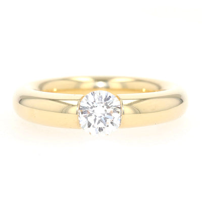Niessing Spannring in 750er Gelbgold mit einem Brillanten ca. 1,0 ct, liegend frontal