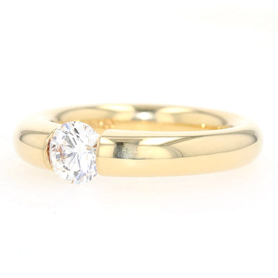 Niessing Spannring in 750er Gelbgold mit einem Brillanten ca. 1,0 ct, liegend links gedreht