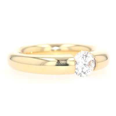 Niessing Spannring in 750er Gelbgold mit einem Brillanten ca. 1,0 ct, liegend rechts gedreht