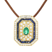 Anhänger in 750er Gelbgold mit Brillanten, blauen Saphiren und einem Smaragd, hängend frontal