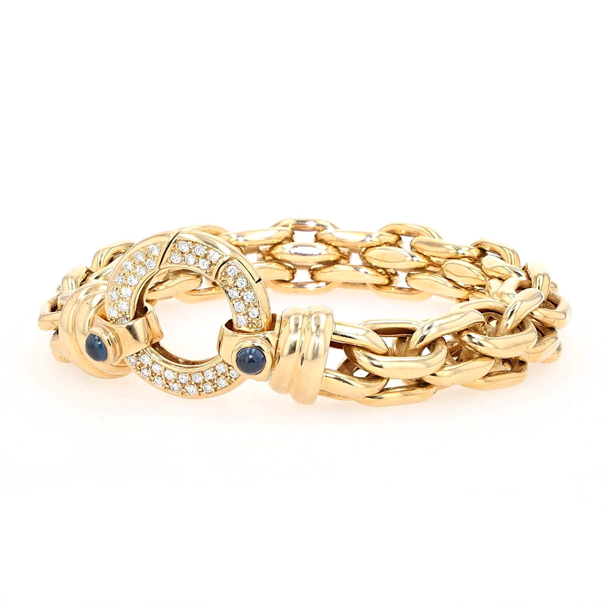 Peter Fischer - großes Gliederarmband von in 585er Gelbgold mit Brillanten und blauen Saphir-Cabochons, liegend links gedreht Schloss aufrecht