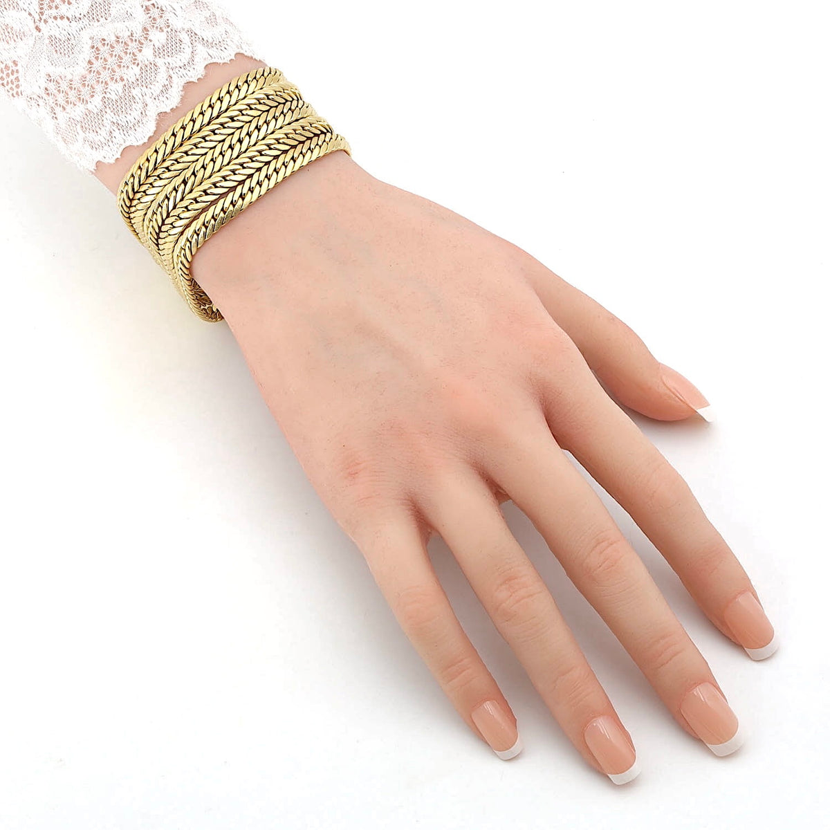 UNOAERRE Vintage - mehrreihiges Kettengliederarmband aus 750er Gelbgold, an einem künstlichen Arm