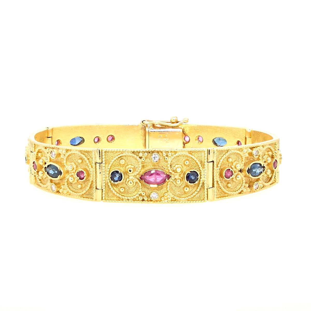 Armband in 750er Gelbgold mit Brillanten, Rubinen und blauen Saphiren, liegend geschlossen frontal
